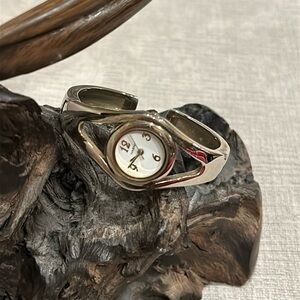 Narmi silver, and gold tone bracelet watch. Batteries needed.